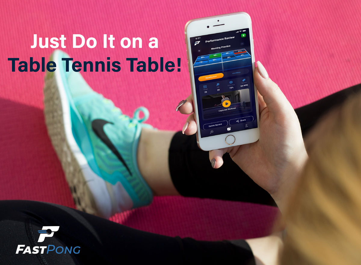 Just Do It on a table tennis table! Person holding a mobile phone with the Fastpong app