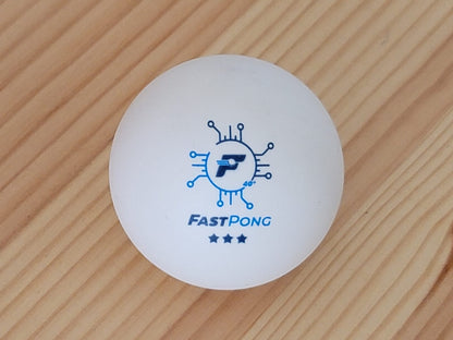Fastpong table tennis ball on a wooden background
