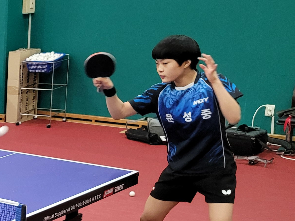 Young person playing table tennis