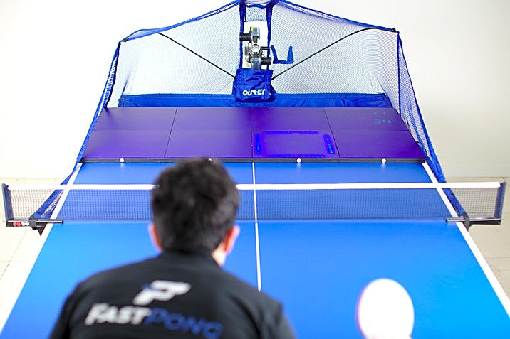 Table tennis player using the Fastpong system for training