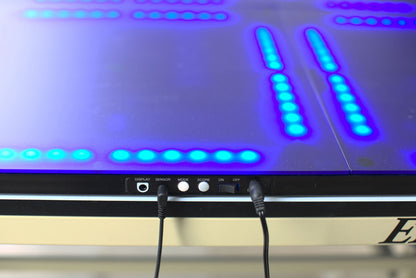 A close up view of the physical buttons, connectors and on/off switch on the rightmost Fastpong tile. 